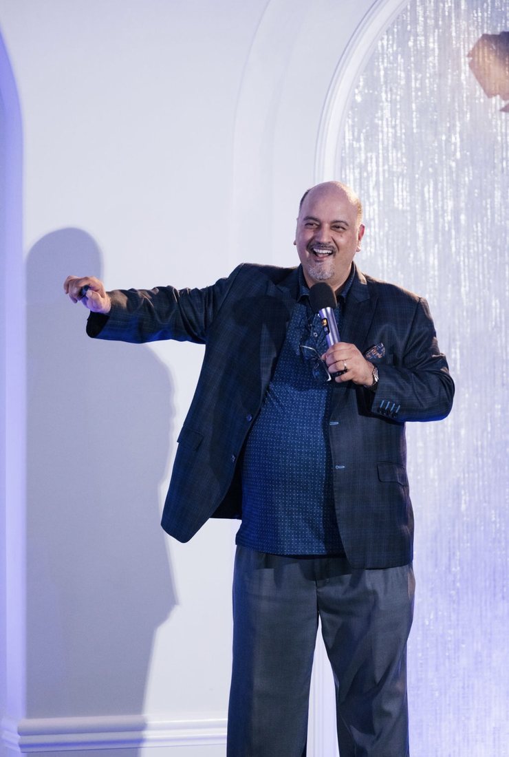 A speaker presenting at TELŌS in September 2026