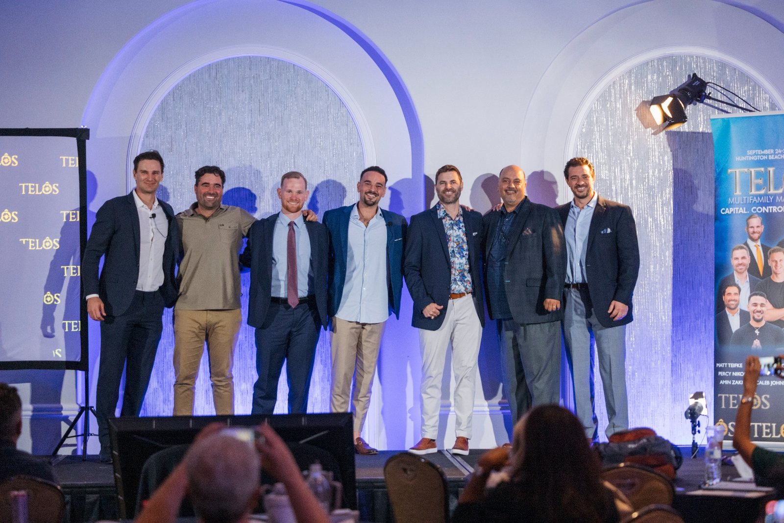 The group on stage at the September 2026 TELŌS Mastermind